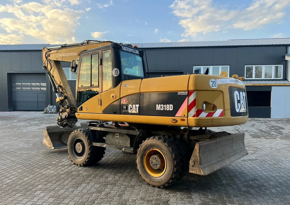 CAT Caterpillar M318D - Pelle sur pneus: photos 4 CAT Caterpillar M318D - Pelle sur pneus: photos 4
