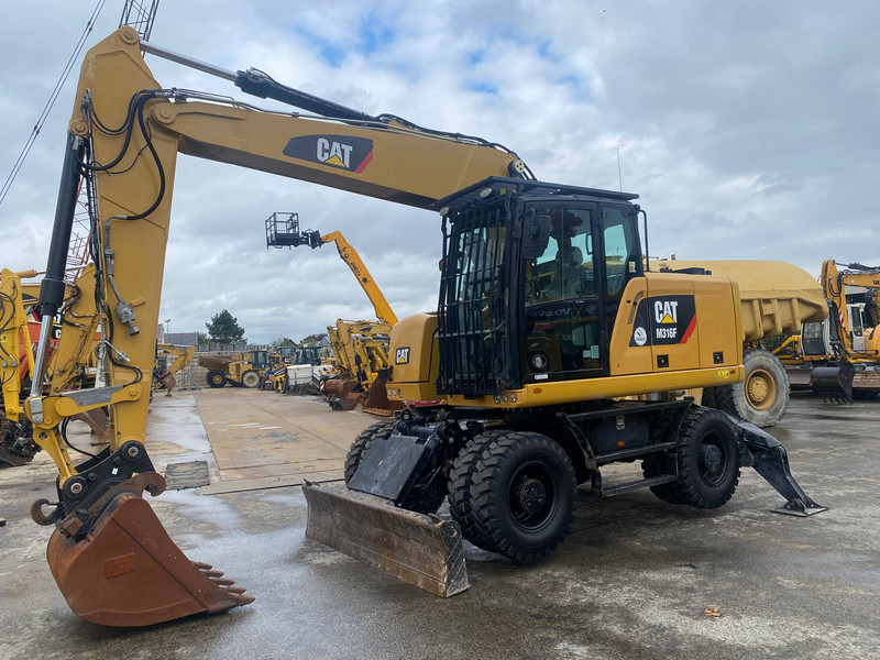 Caterpillar M316F NVT - Pelle sur pneus: photos 1 Caterpillar M316F NVT - Pelle sur pneus: photos 1