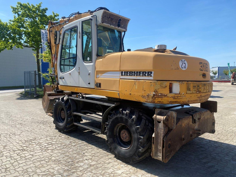Liebherr A316 Litronic A 316 litronic - Pelle sur pneus: photos 1 Liebherr A316 Litronic A 316 litronic - Pelle sur pneus: photos 1