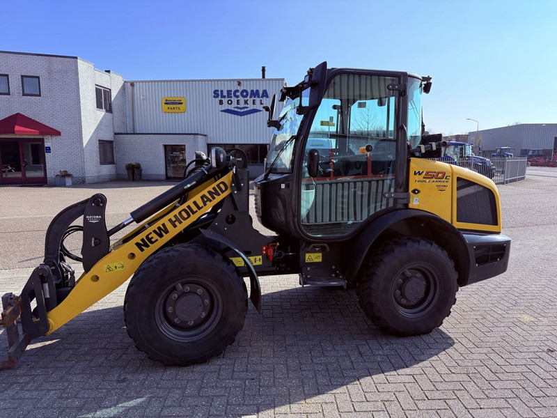 New Holland W50 TC Wiellader - Chargeuse sur pneus: photos 1 New Holland W50 TC Wiellader - Chargeuse sur pneus: photos 1