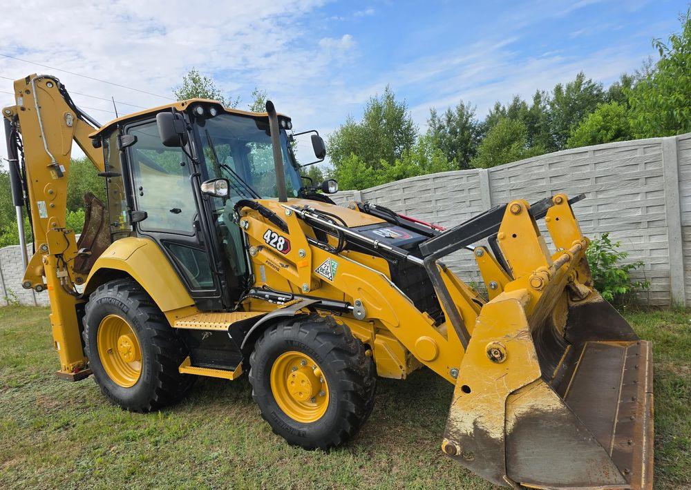 Caterpillar - Tractopelle: photos 1 Caterpillar - Tractopelle: photos 1