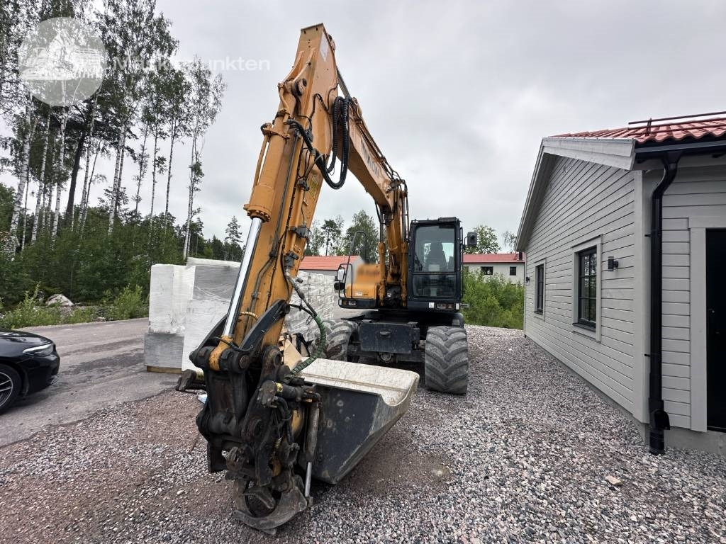 Hyundai Robex 140 W-7 A - Pelle sur pneus: photos 2 Hyundai Robex 140 W-7 A - Pelle sur pneus: photos 2