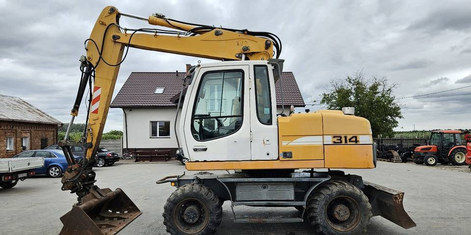 Koparka kołowa Liebherr A314 Litronic 9350 h 4 łyżki kołówka - Pelle sur pneus: photos 1 Koparka kołowa Liebherr A314 Litronic 9350 h 4 łyżki kołówka - Pelle sur pneus: photos 1