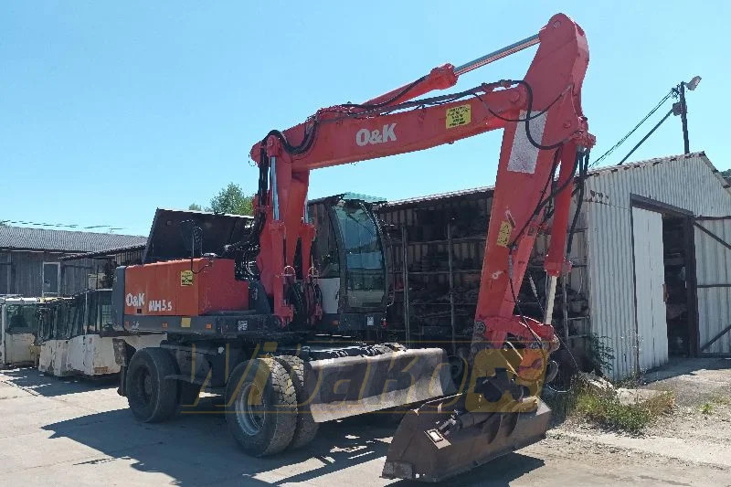 O&K MH5.5 - Pelle sur pneus: photos 1 O&K MH5.5 - Pelle sur pneus: photos 1