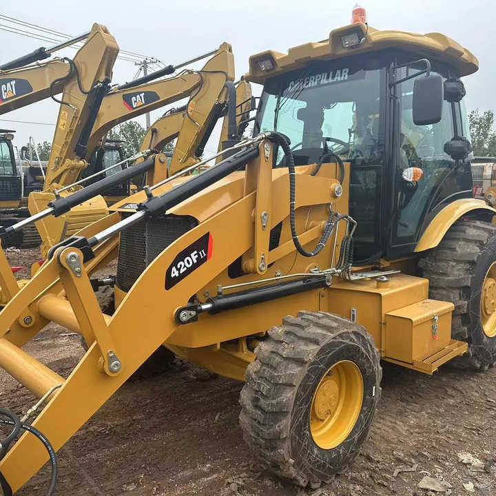 Used Wheel Loader CAT420F Caterpillar 420F Mini Construction Machinery Mini Wheel Skid Steer Loader in Stock - Tractopelle: photos 1 Used Wheel Loader CAT420F Caterpillar 420F Mini Construction Machinery Mini Wheel Skid Steer Loader in Stock - Tractopelle: photos 1