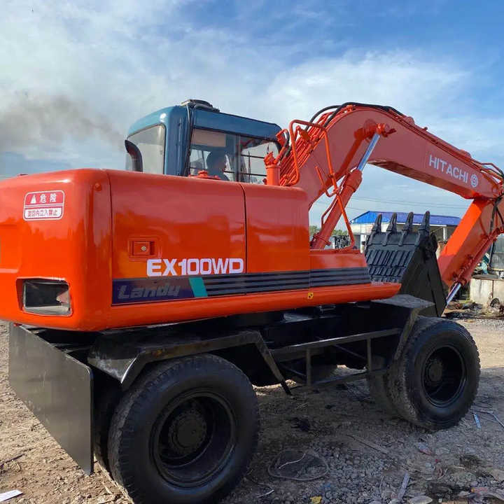 Used Hitachi Ex100WD Wheel Excavator for Sale Japan Made Hitachi Ex100wd Wheeled Excavator for Sale - Pelle sur chenille: photos 1 Used Hitachi Ex100WD Wheel Excavator for Sale Japan Made Hitachi Ex100wd Wheeled Excavator for Sale - Pelle sur chenille: photos 1