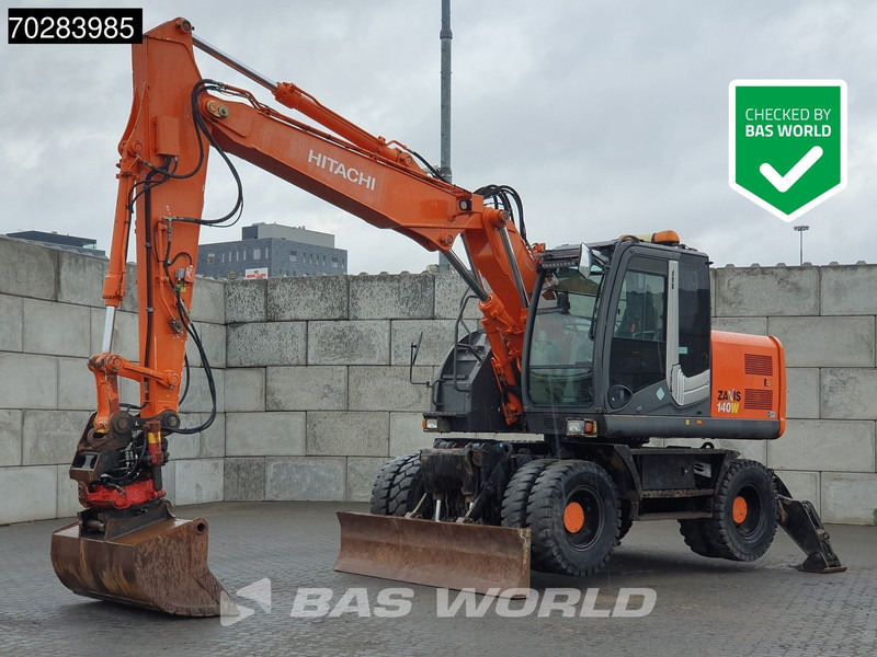 Hitachi ZX140W -3 OUTRIGGERS - ROTOTILT - Pelle sur pneus: photos 1 Hitachi ZX140W -3 OUTRIGGERS - ROTOTILT - Pelle sur pneus: photos 1