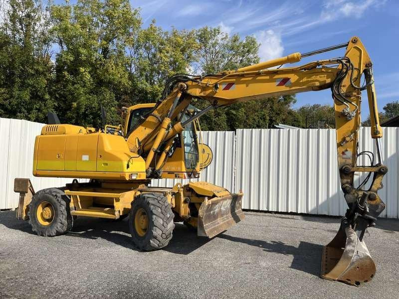 Volvo EW140D - Pelle sur pneus: photos 1 Volvo EW140D - Pelle sur pneus: photos 1