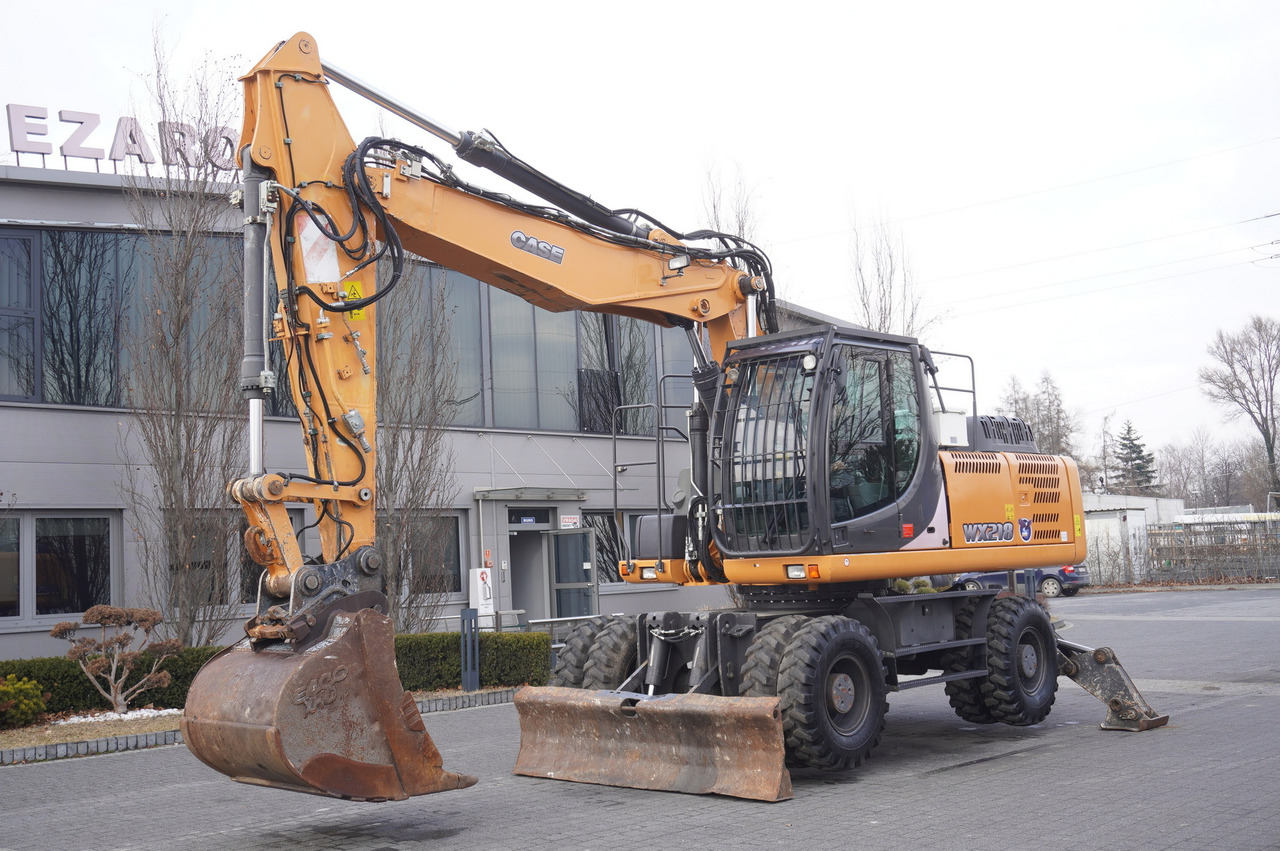 CASE WX218 / 23t wheeled excavator / 3 times folding arm - Pelle sur pneus: photos 2 CASE WX218 / 23t wheeled excavator / 3 times folding arm - Pelle sur pneus: photos 2