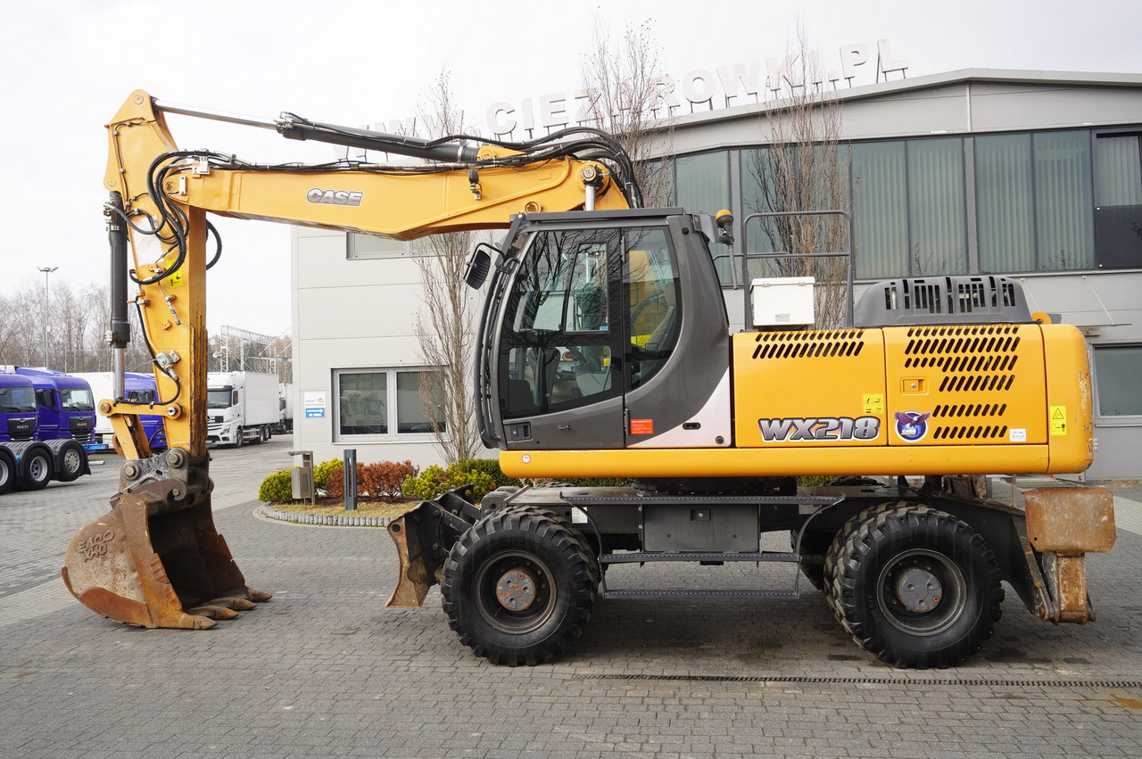 CASE WX218 / 23t wheeled excavator / 3 times folding arm - Pelle sur pneus: photos 1 CASE WX218 / 23t wheeled excavator / 3 times folding arm - Pelle sur pneus: photos 1