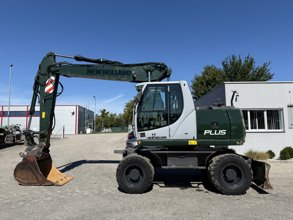 New Holland MH-Plus (111695) - Pelle sur pneus: photos 1 New Holland MH-Plus (111695) - Pelle sur pneus: photos 1