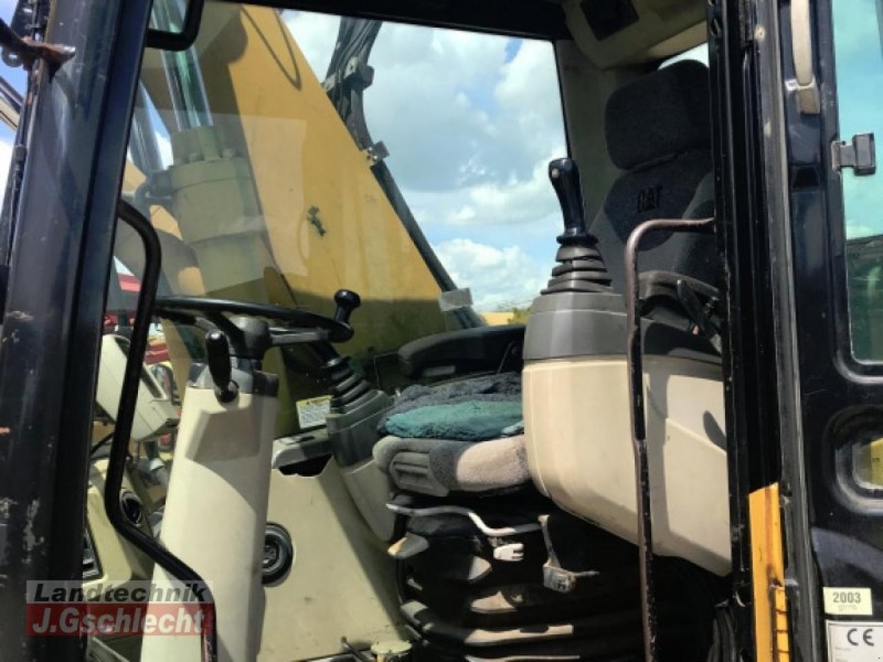 Pelle sur pneus Caterpillar m 315c: photos 12