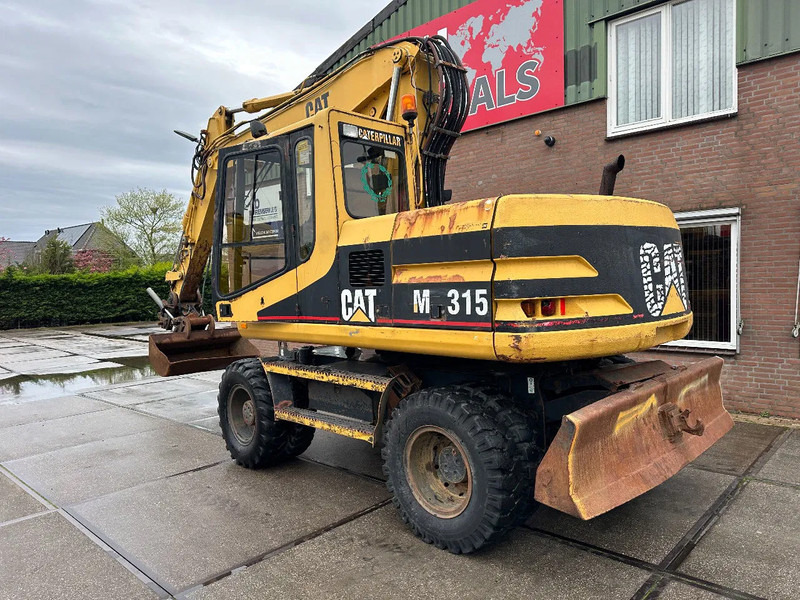 Caterpillar M315 +ROTO CE - Pelle sur pneus: photos 4 Caterpillar M315 +ROTO CE - Pelle sur pneus: photos 4