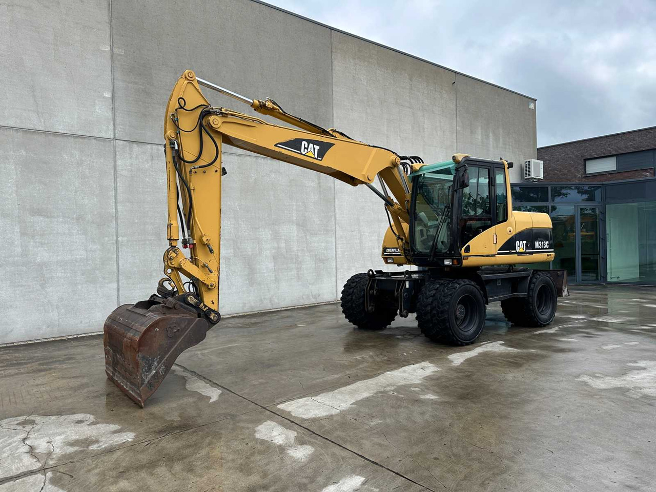Caterpillar M313C - Pelle sur pneus: photos 1 Caterpillar M313C - Pelle sur pneus: photos 1