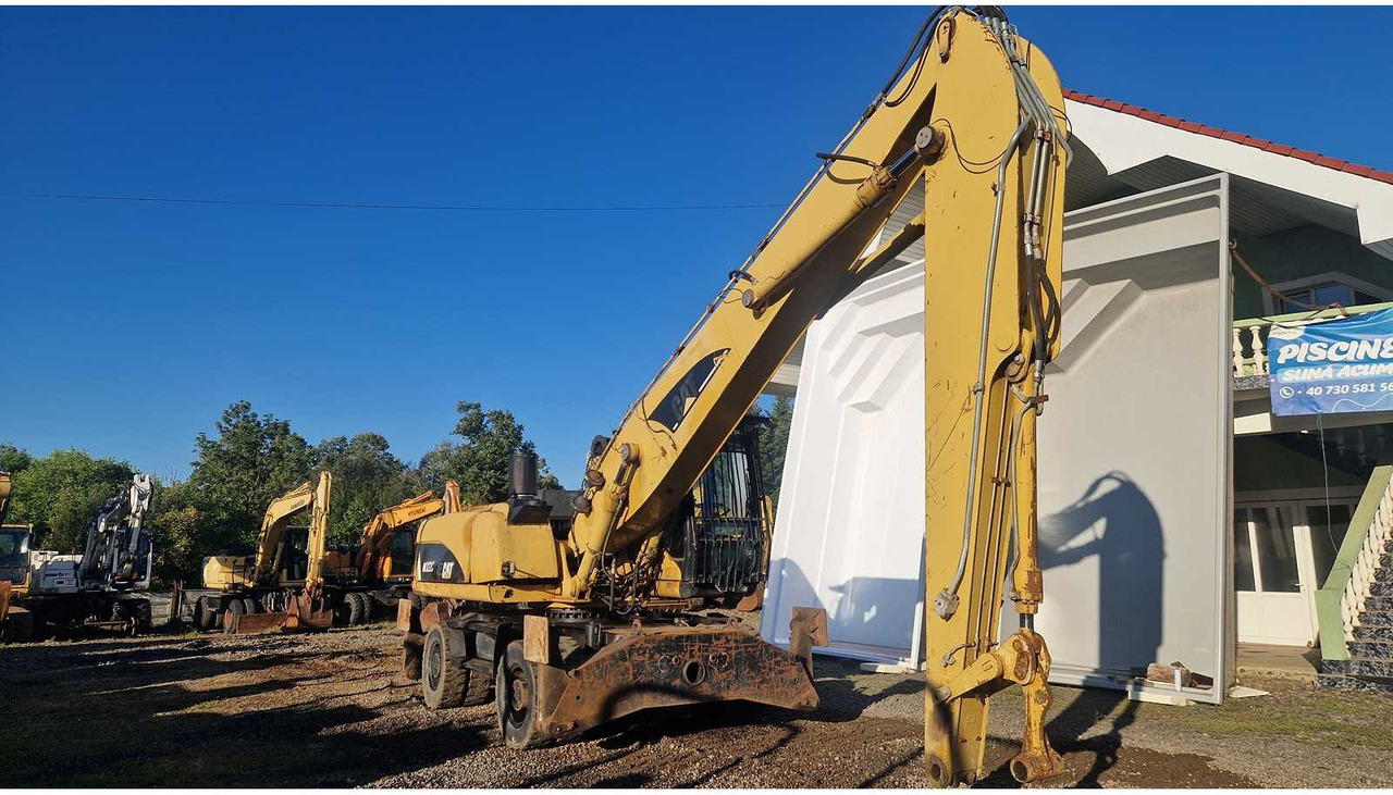 Caterpillar M322C - Pelle sur pneus: photos 4 Caterpillar M322C - Pelle sur pneus: photos 4