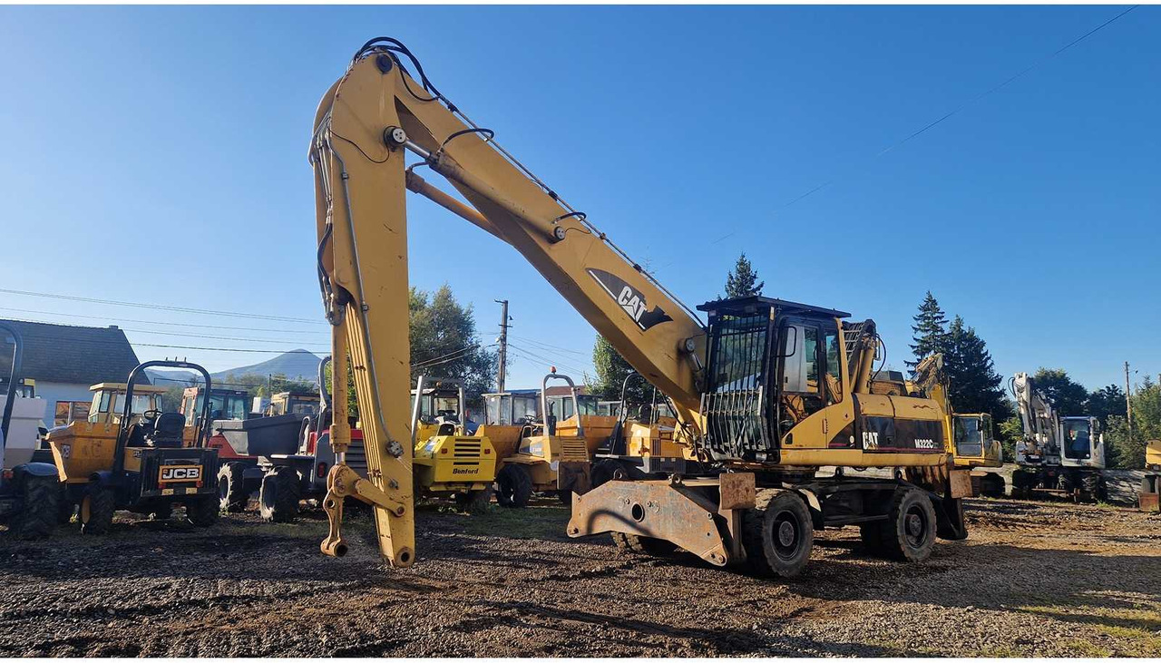 Caterpillar M322C - Pelle sur pneus: photos 1 Caterpillar M322C - Pelle sur pneus: photos 1