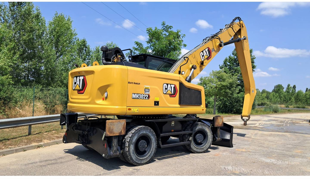 CAT MH3022-1 - Pelle sur pneus: photos 3 CAT MH3022-1 - Pelle sur pneus: photos 3