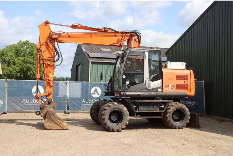 Hitachi ZX140W-3 - Pelle sur pneus: photos 1 Hitachi ZX140W-3 - Pelle sur pneus: photos 1