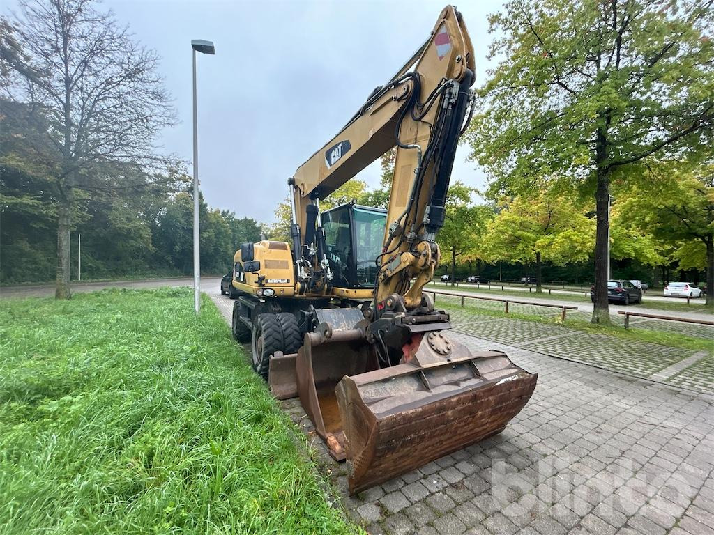 CAT M 318D - Pelle sur pneus: photos 2 CAT M 318D - Pelle sur pneus: photos 2