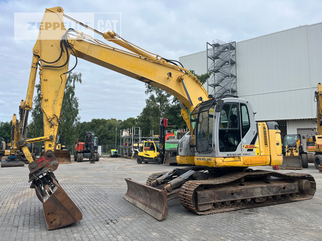 New Holland E235 - Pelle sur chenille: photos 1 New Holland E235 - Pelle sur chenille: photos 1